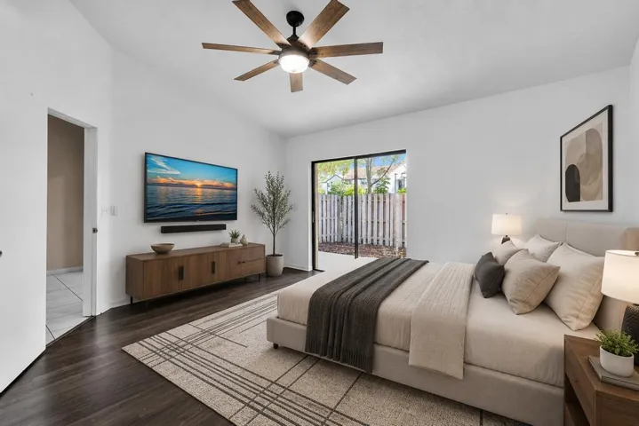 VIRTUALLY STAGED - PRIMARY BEDROOM WITH VAULTED CEILINGS