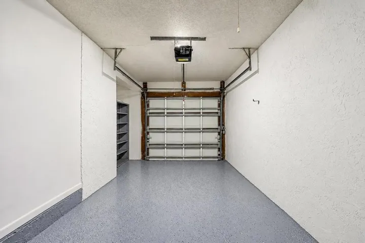 FRESHLY PAINTED GARAGE WITH EPOXY FLOOR