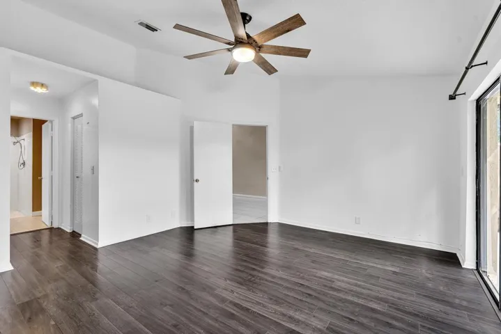 PRIMARY BEDROOM WITH VAULTED CEILINGS