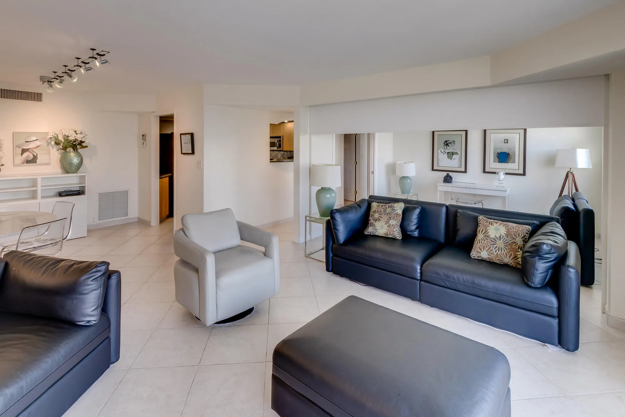 White tile flooring complements the bright white walls and ceiling