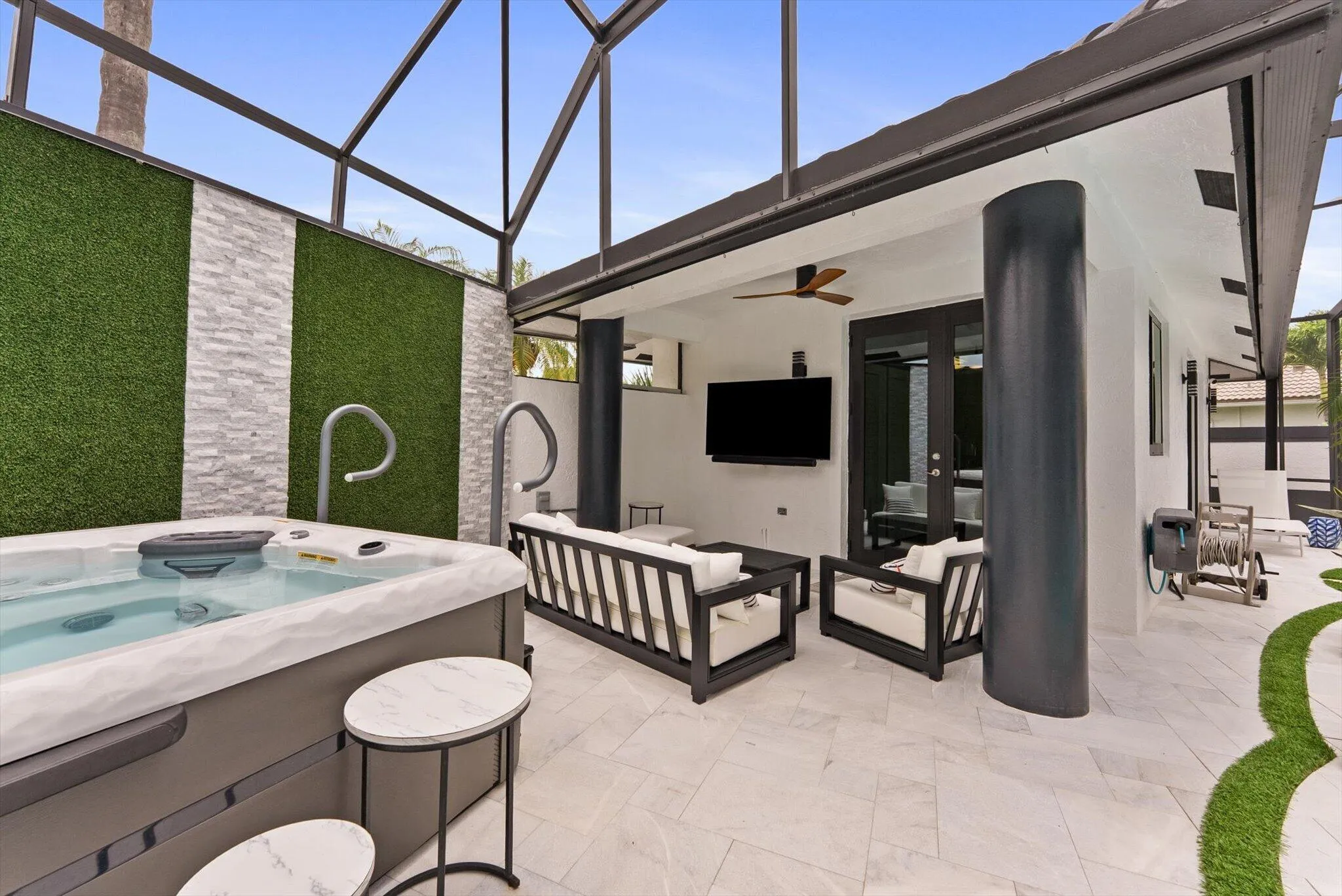 covered sitting area and hot tub