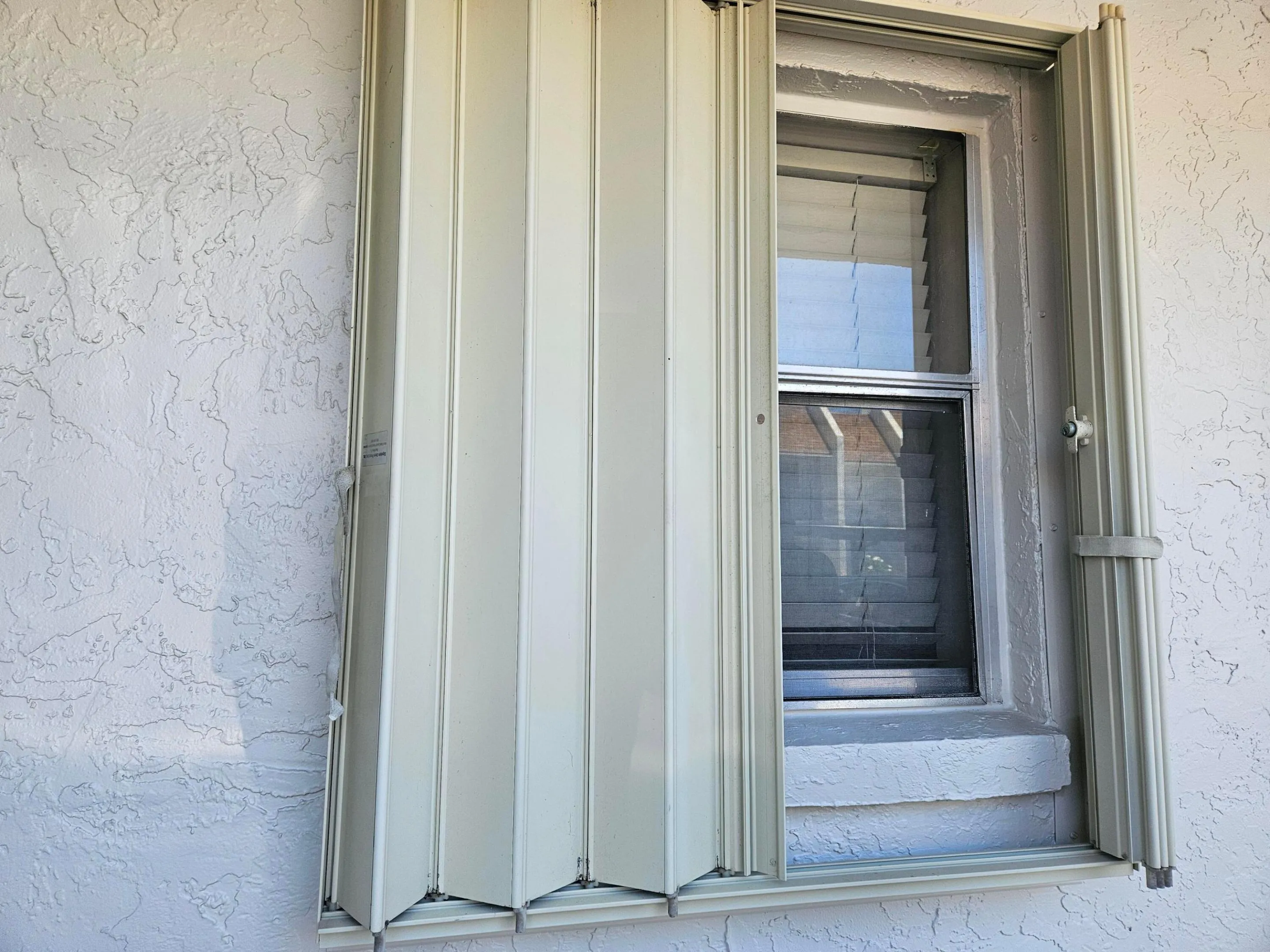 ACCORDIAN SHUTTERS