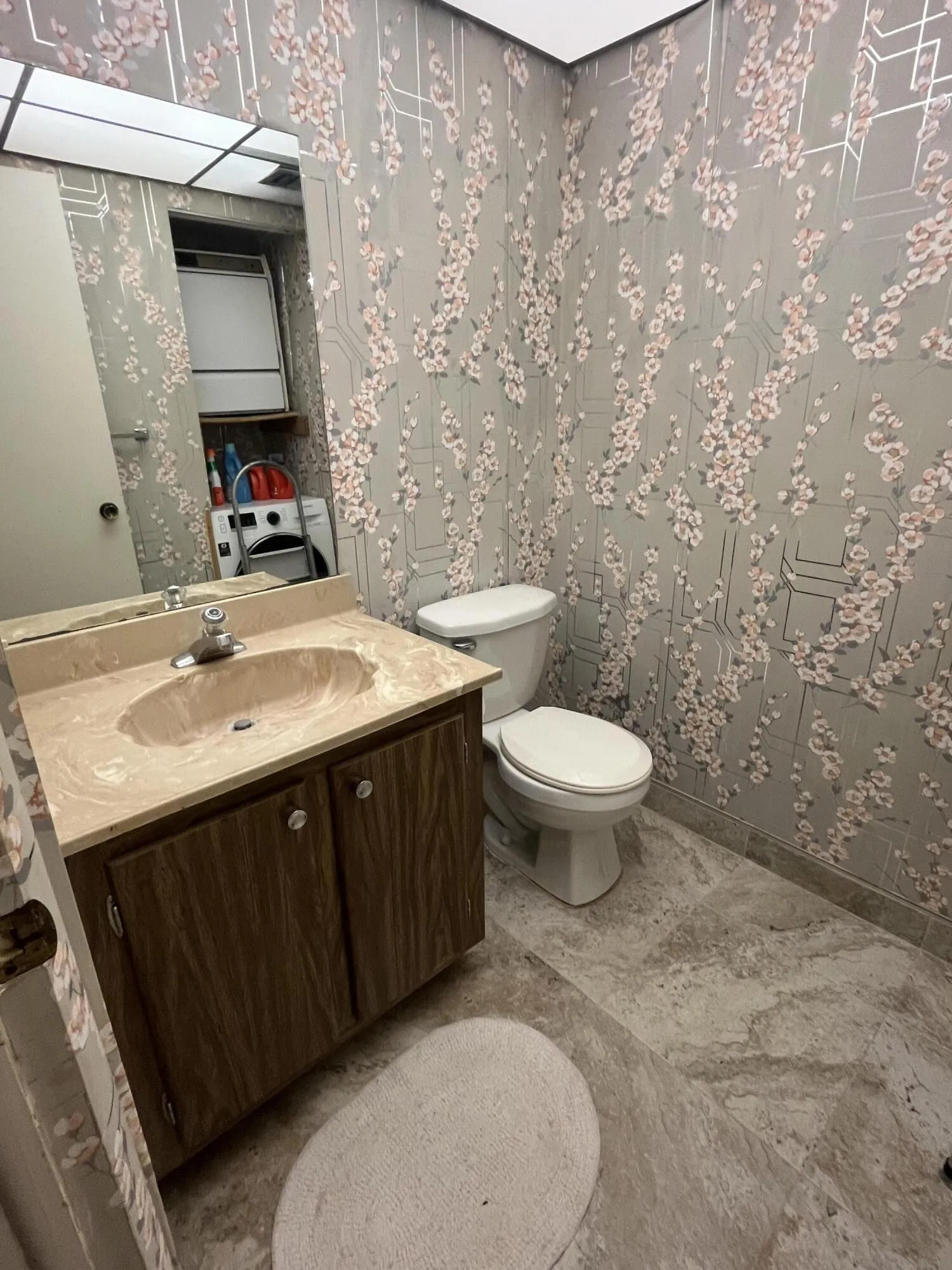 GUEST, half bathroom that has stackable washer/dryer in closet within.