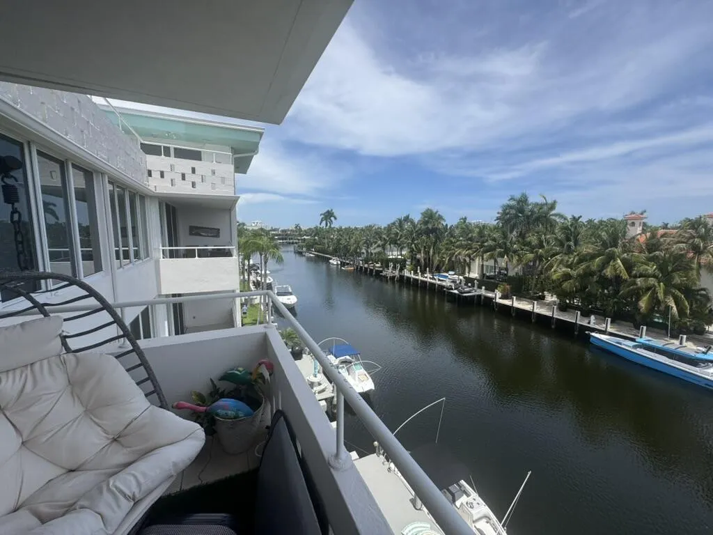 Private balcony with metal railing, offering canal frontage and waterway access