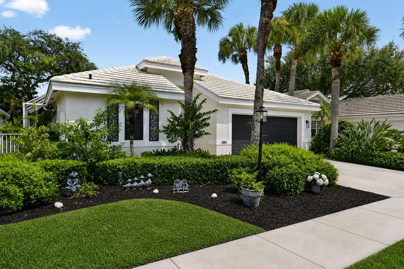 Stucco exterior with a tiled roof