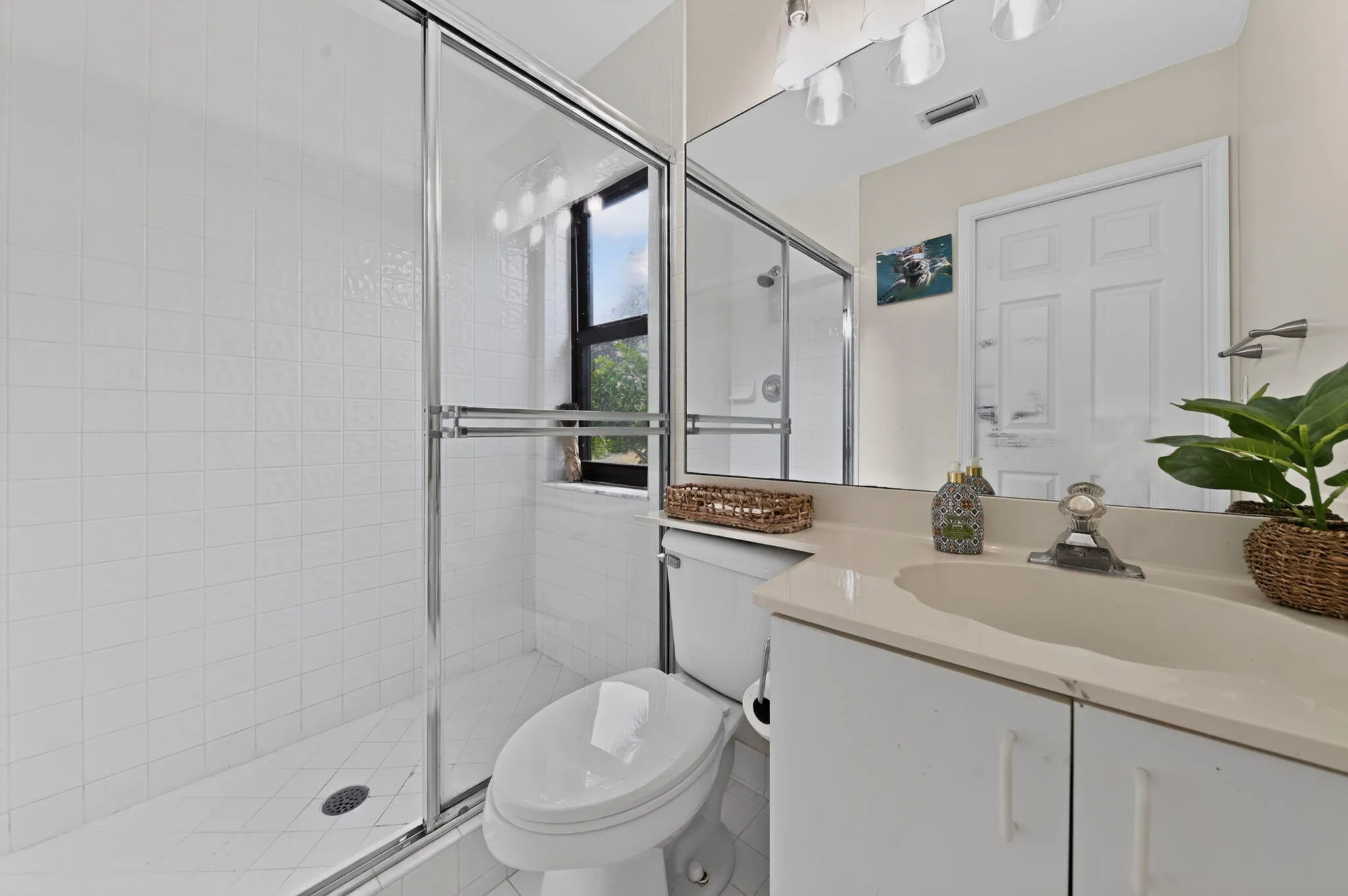 En-suite guest house bath with vanity, undermount sink and countertop