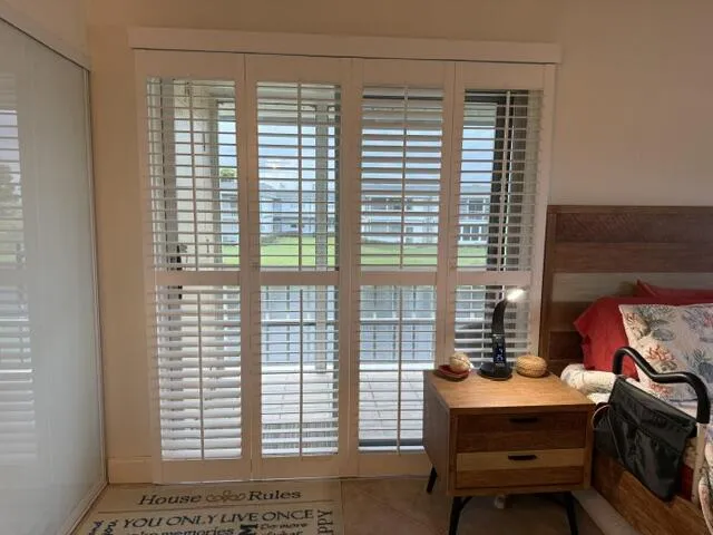 Bedroom - Plantation Shutters in front of sliders