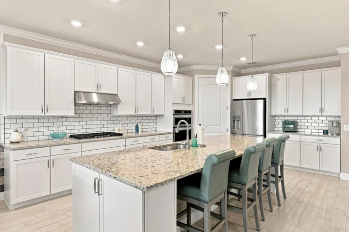 Kitchen with granite counter tops, natural gas range, wall oven & microwave