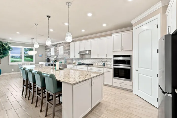Kitchen island with seating for 4, storage at both ends, sink with instahot water heater, & dishwasher