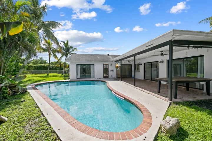Beautiful pool area with large yard