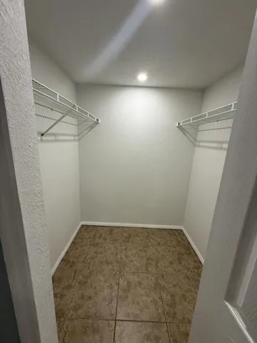 PRIMARY BEDROOM WALK IN CLOSET