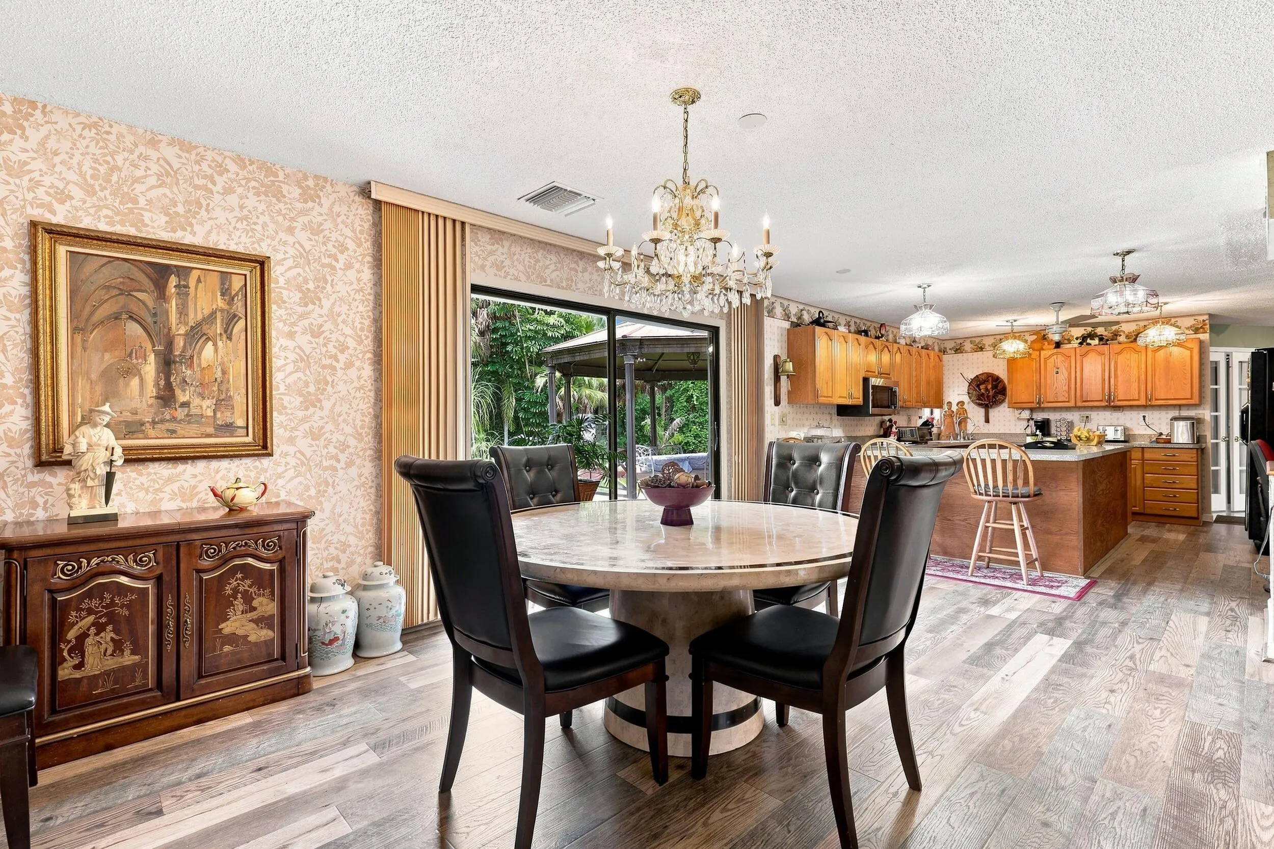 Open dining space with updated flooring and easy flow into the adjoining kitchen.