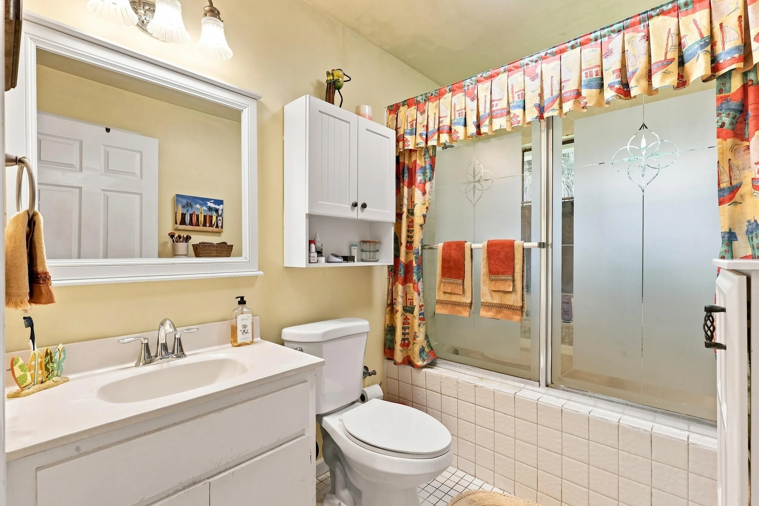 Full bathroom featuring a vanity and tub/shower combination.