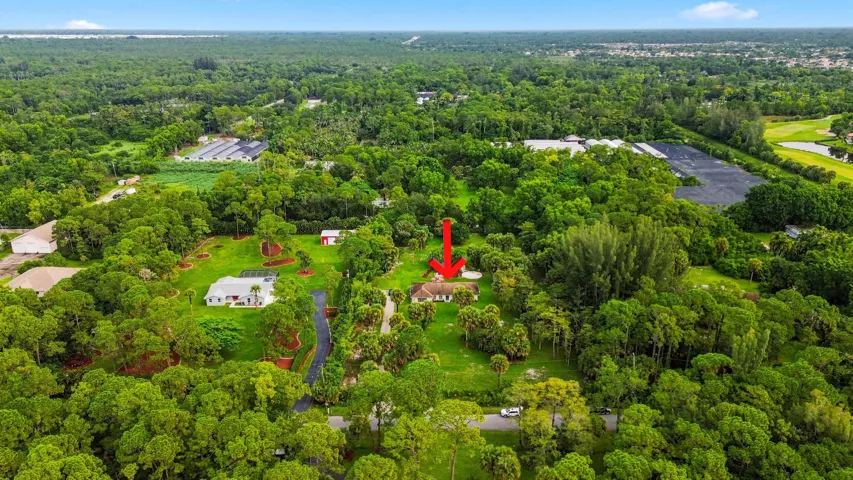 Wide aerial perspective highlighting the property and surrounding Loxahatchee Groves area.