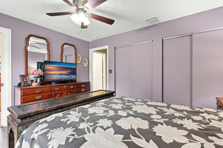 Additional bedroom view highlighting the generous closet storage and comfortable layout.