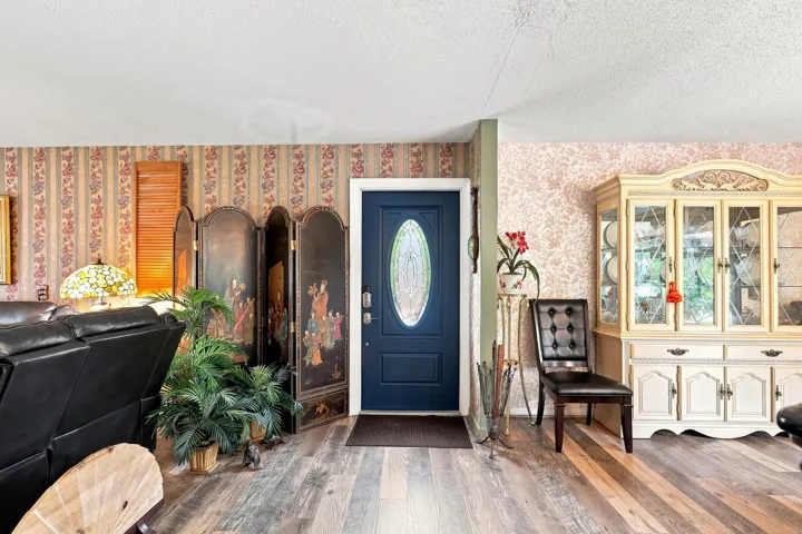 Welcoming interior with updated flooring and an open flow into the adjoining living spaces.