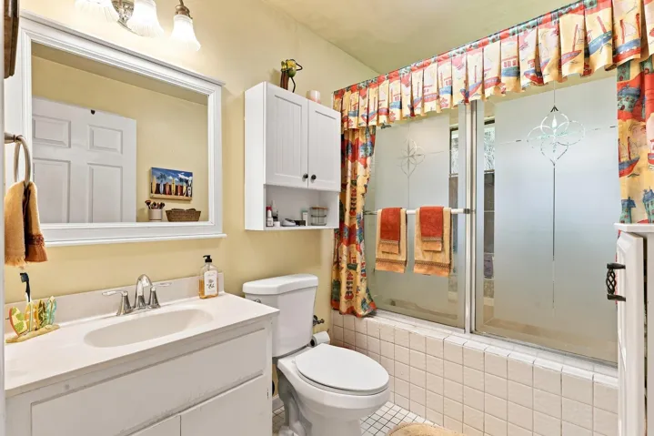 Full bathroom featuring a vanity and tub/shower combination.