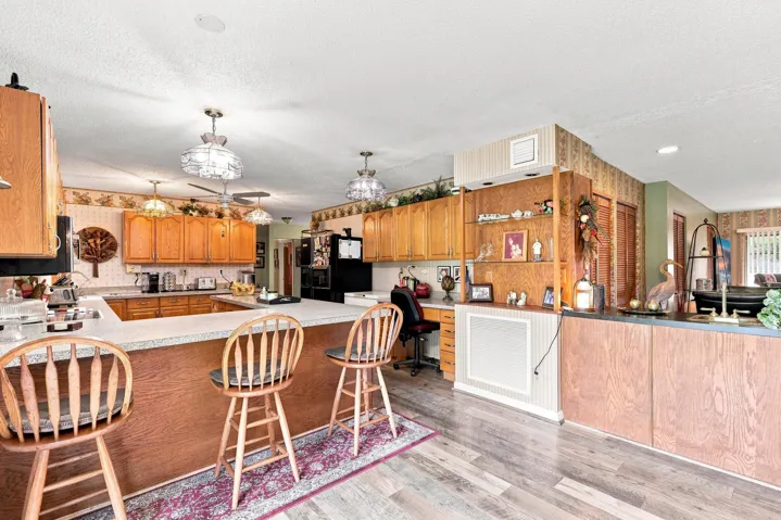 Additional kitchen view highlighting the extensive cabinetry, counter space, and open layout.