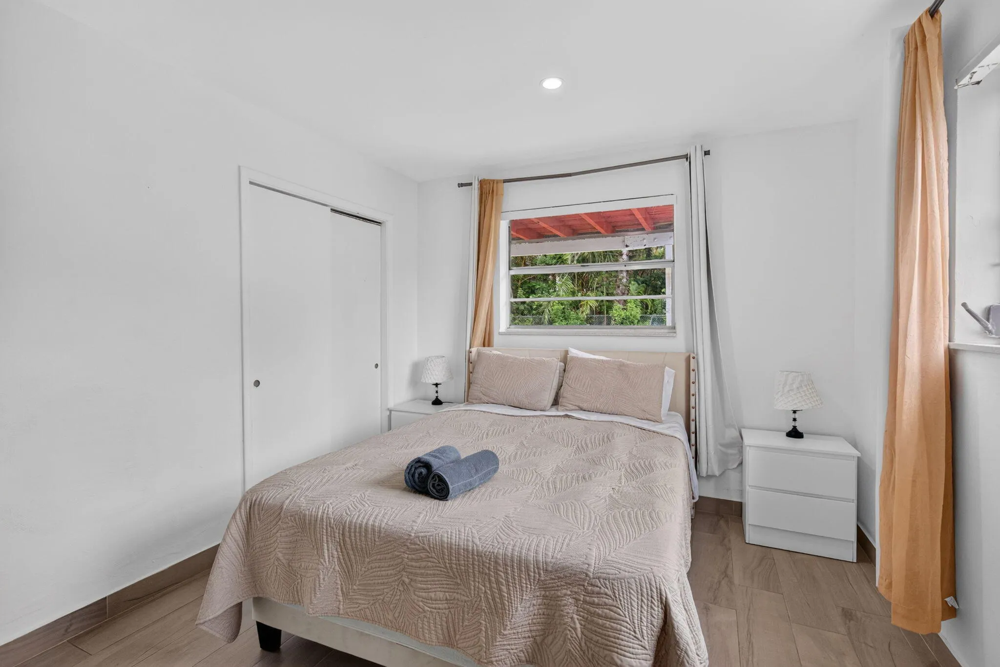 Comfortable Guest Bedroom with Sliding Closet and Garden View