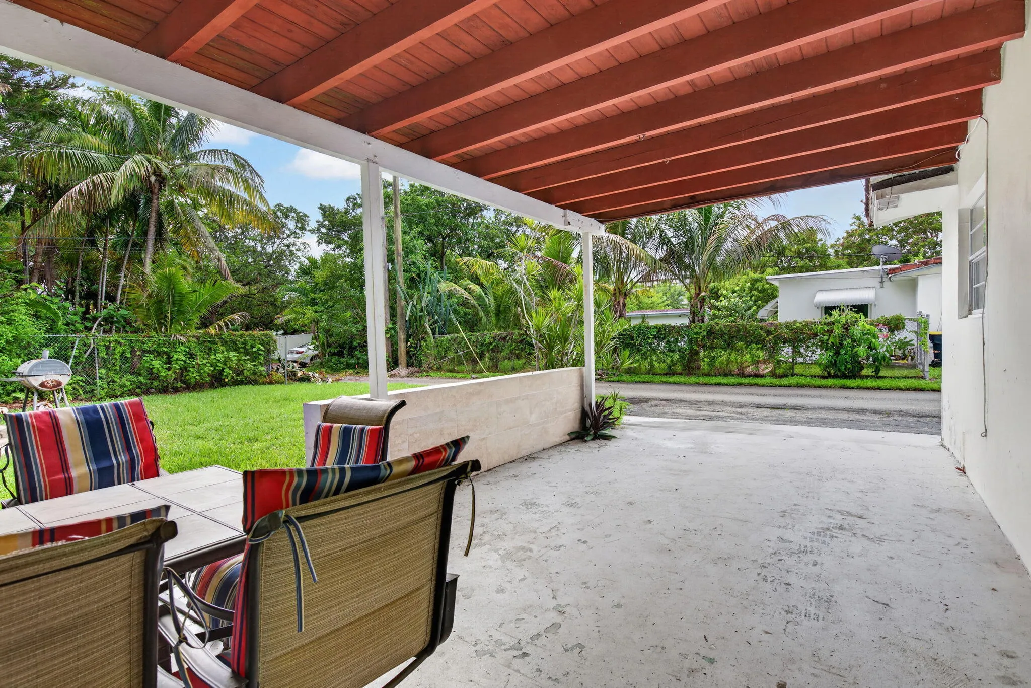 Covered Outdoor Living Area Opening to a Large Private Backyard