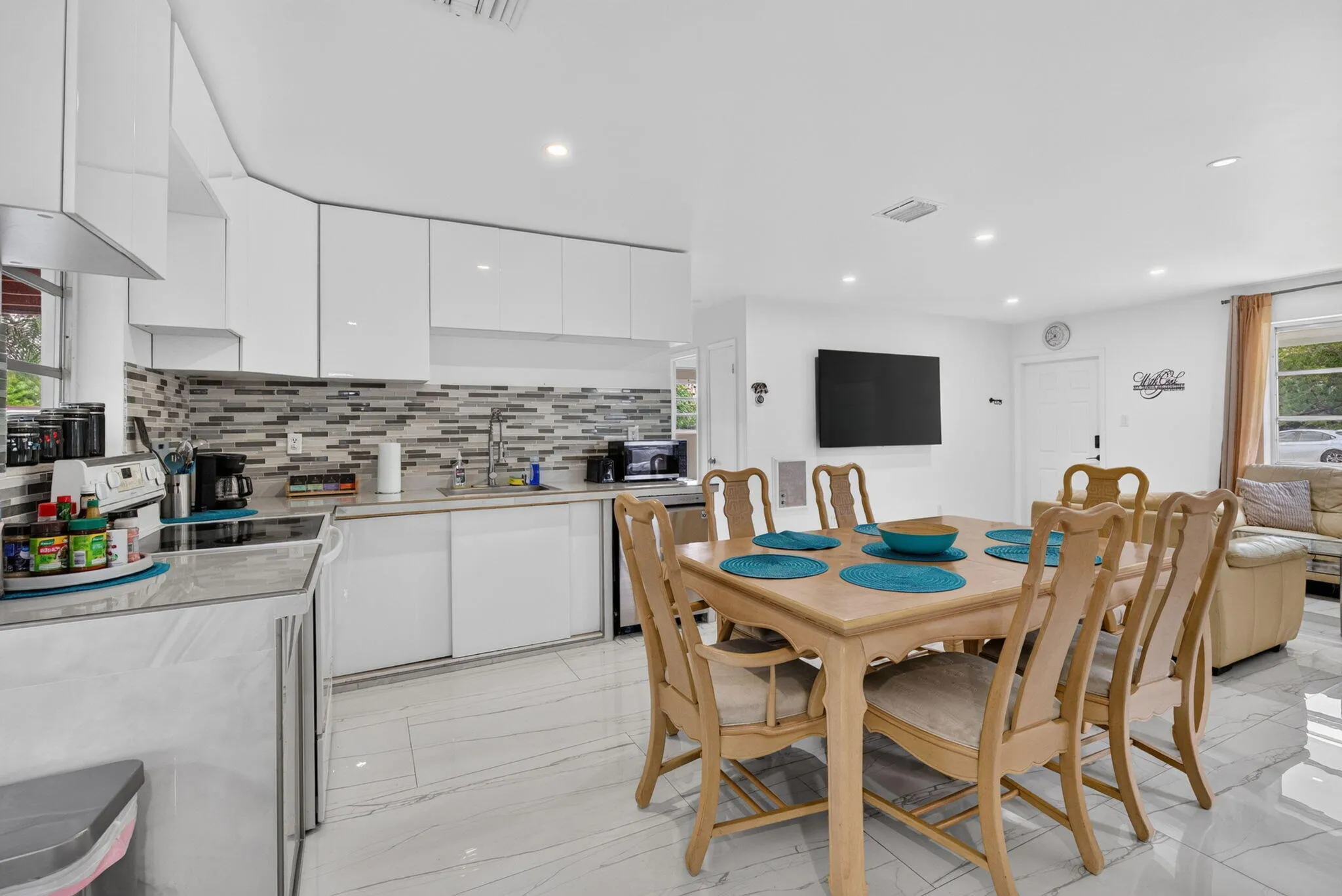 Open Kitchen, Dining and Living — Great Room Layout with Porcelain Tile Floors