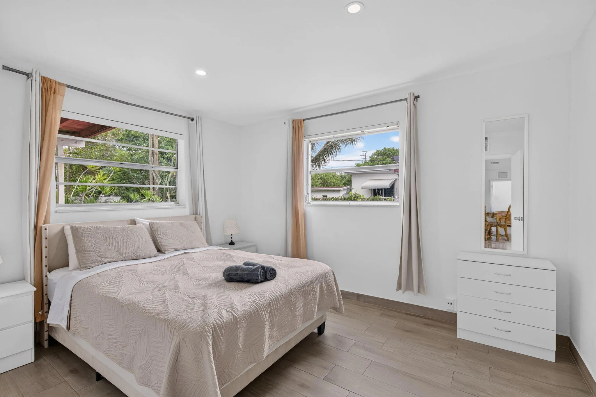 Guest Bedroom — Queen Bed, Dual Windows and Wood-Look Flooring