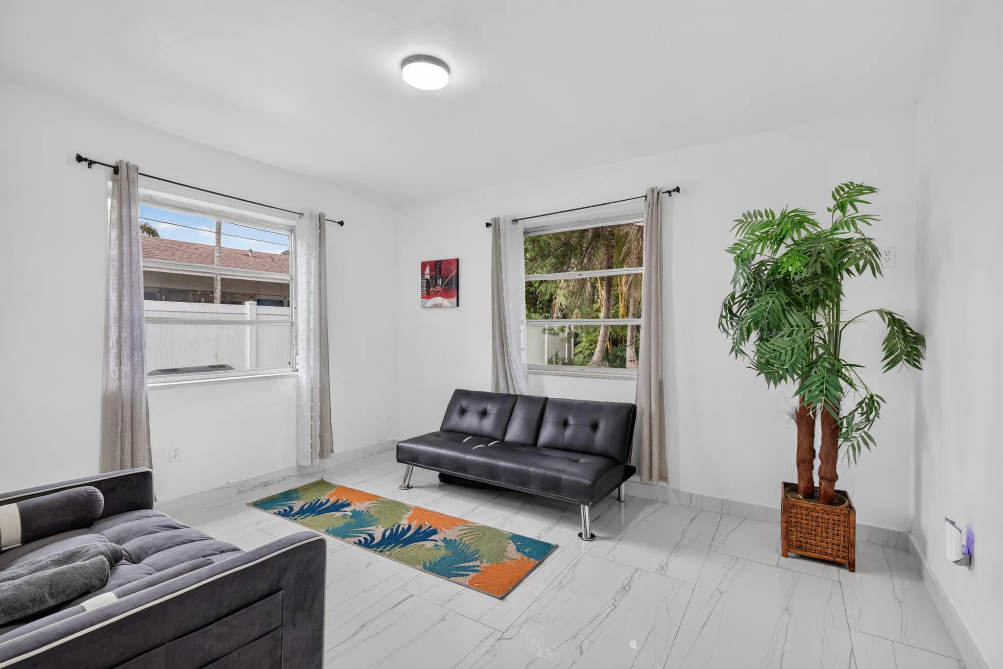 Bright Bonus Room with Dual Windows and Porcelain Tile Flooring