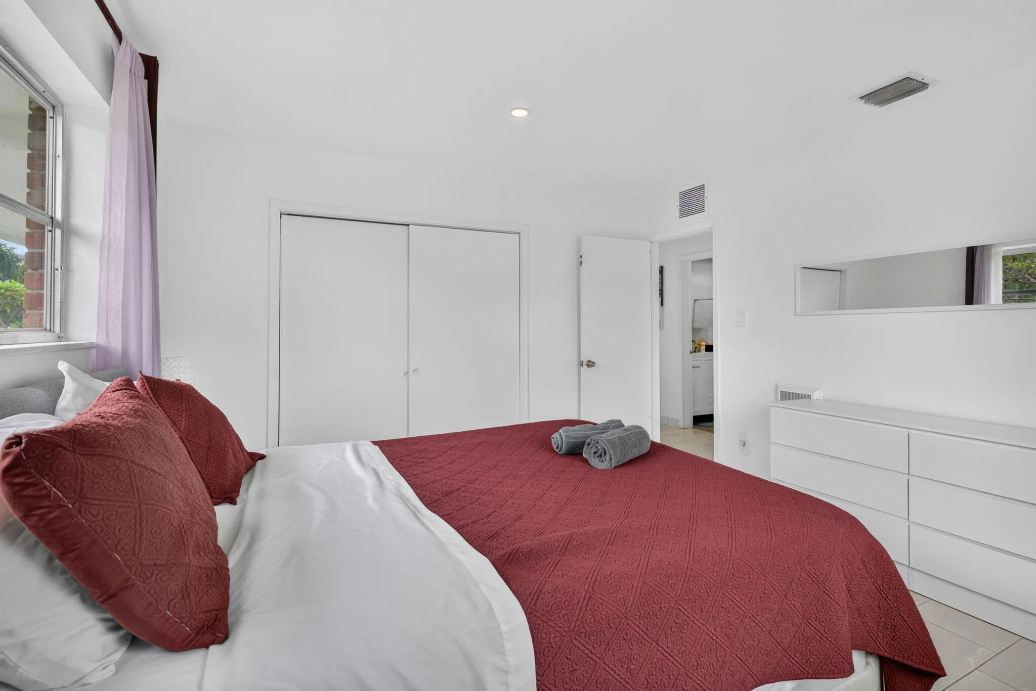 Guest Bedroom with Full Sliding-Door Closet and Dresser