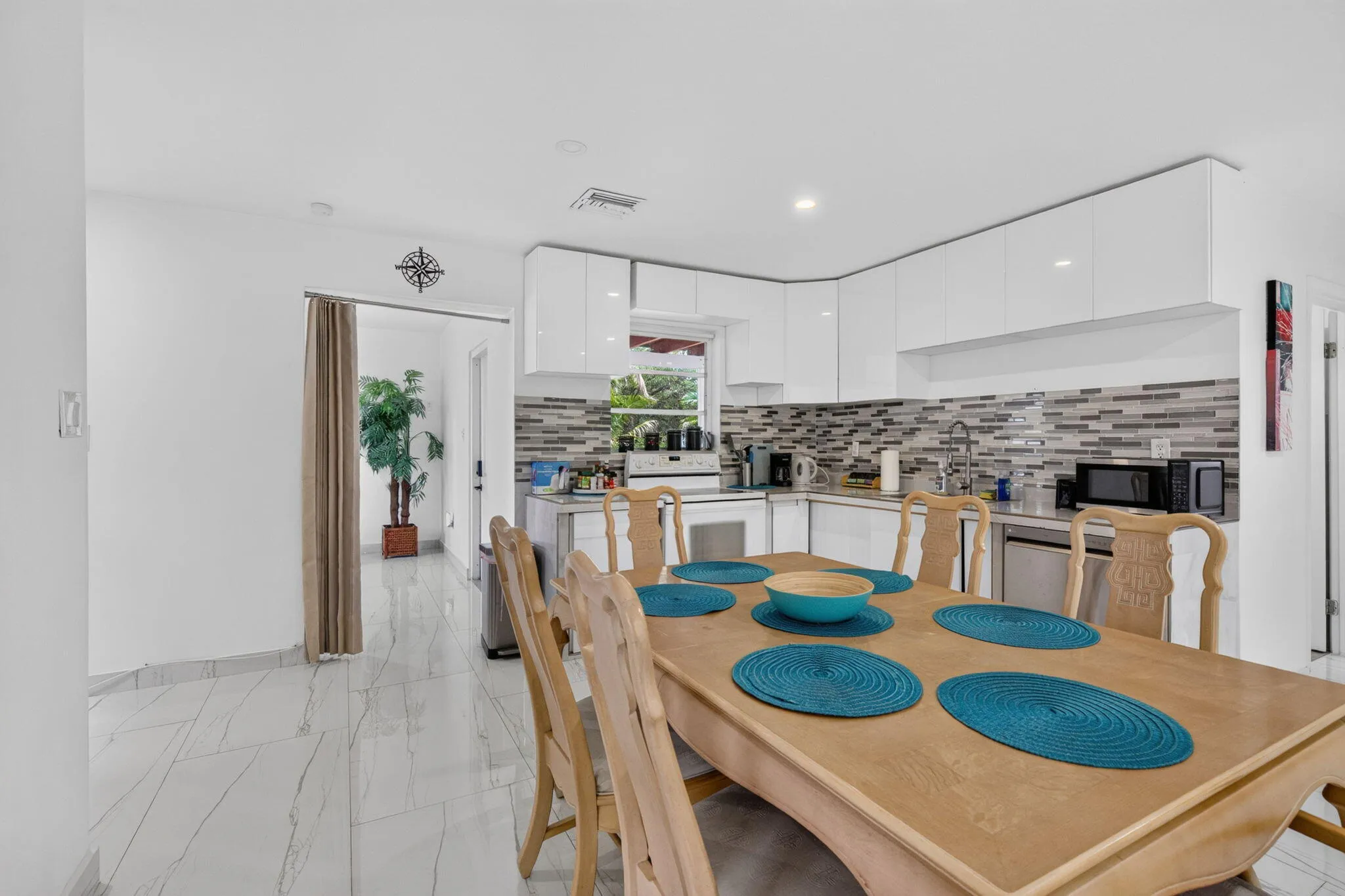 Updated Kitchen with Stainless Appliances, Ample Cabinet Storage and Prep Counter