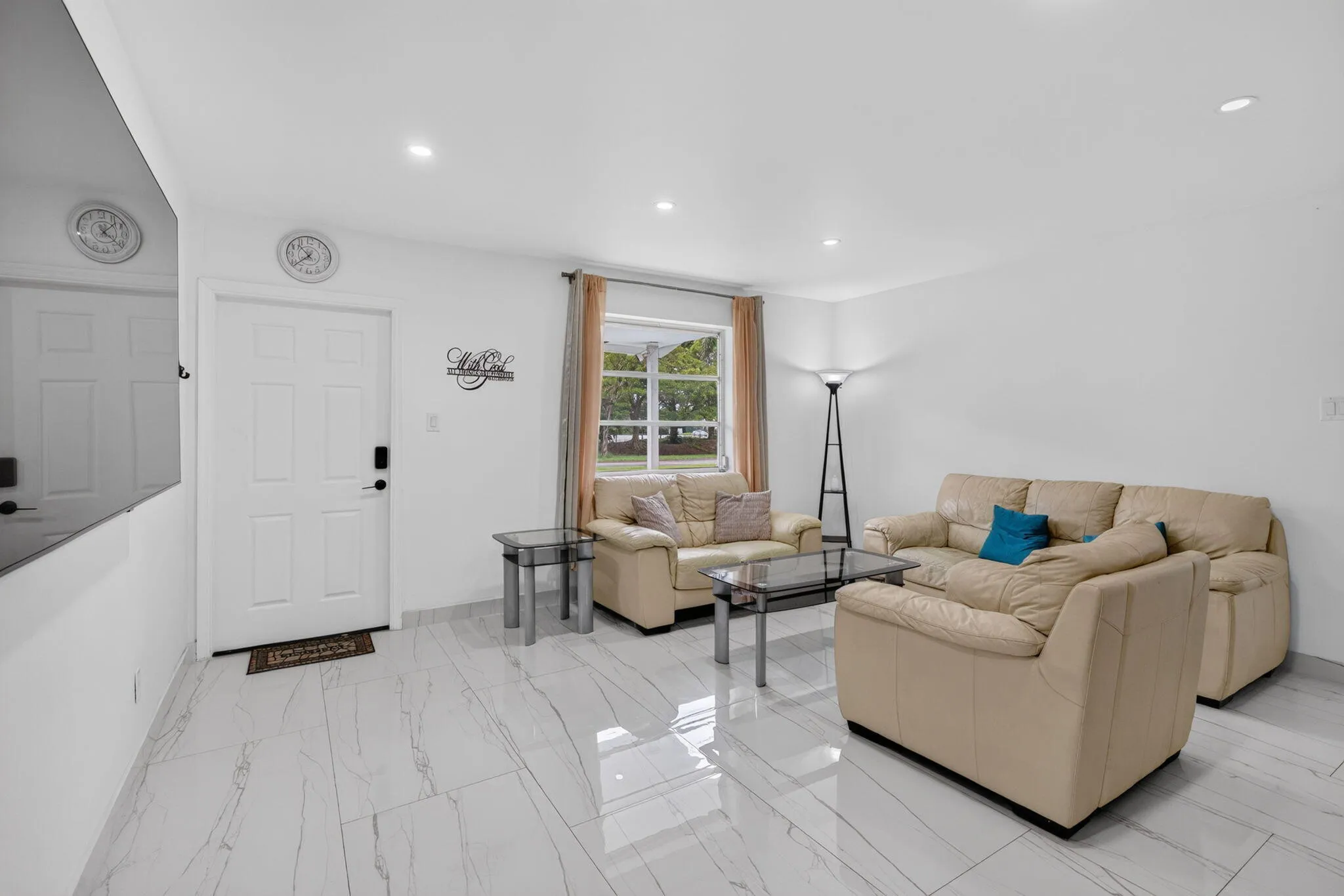 Light-Filled Living Room with Front Entry and Large Picture Window