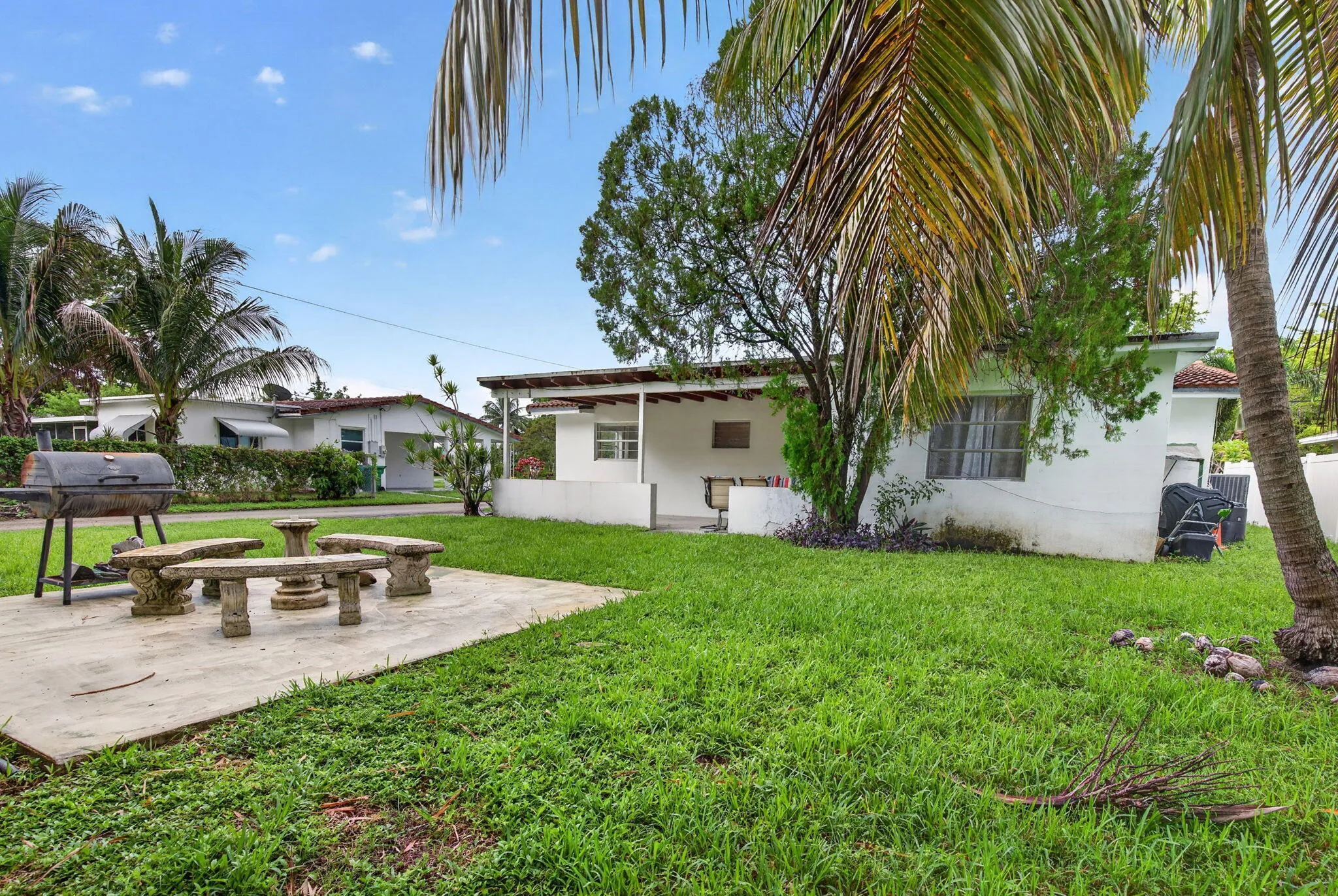 Large Backyard with Patio Pad, Grill Area and Mature Palms