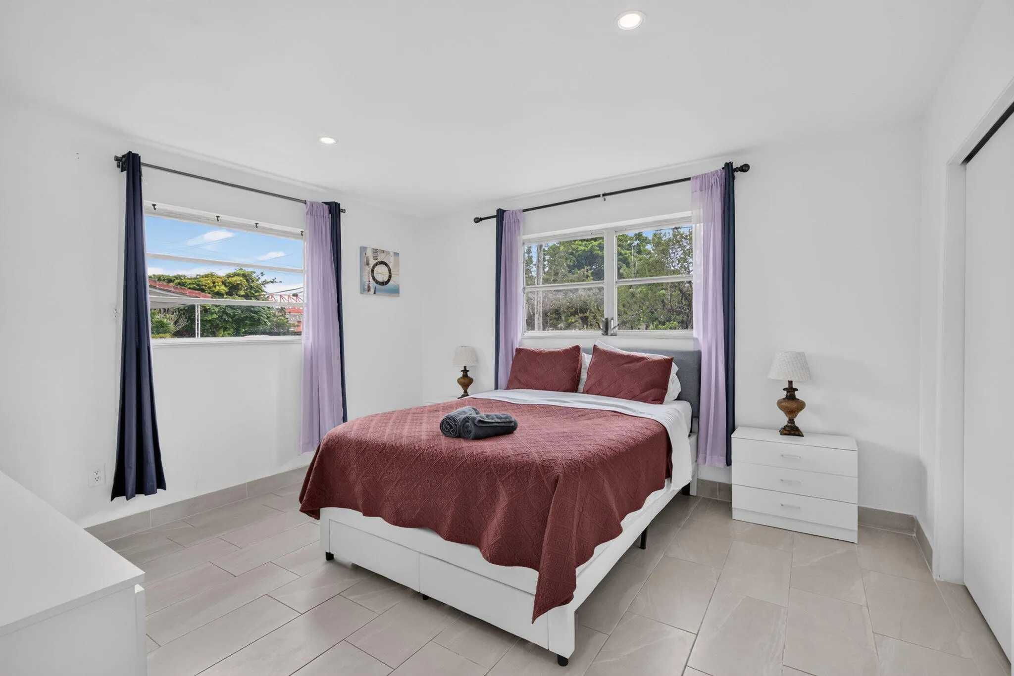 Bright Third Bedroom — Dual Windows and Built-In Dresser Storage