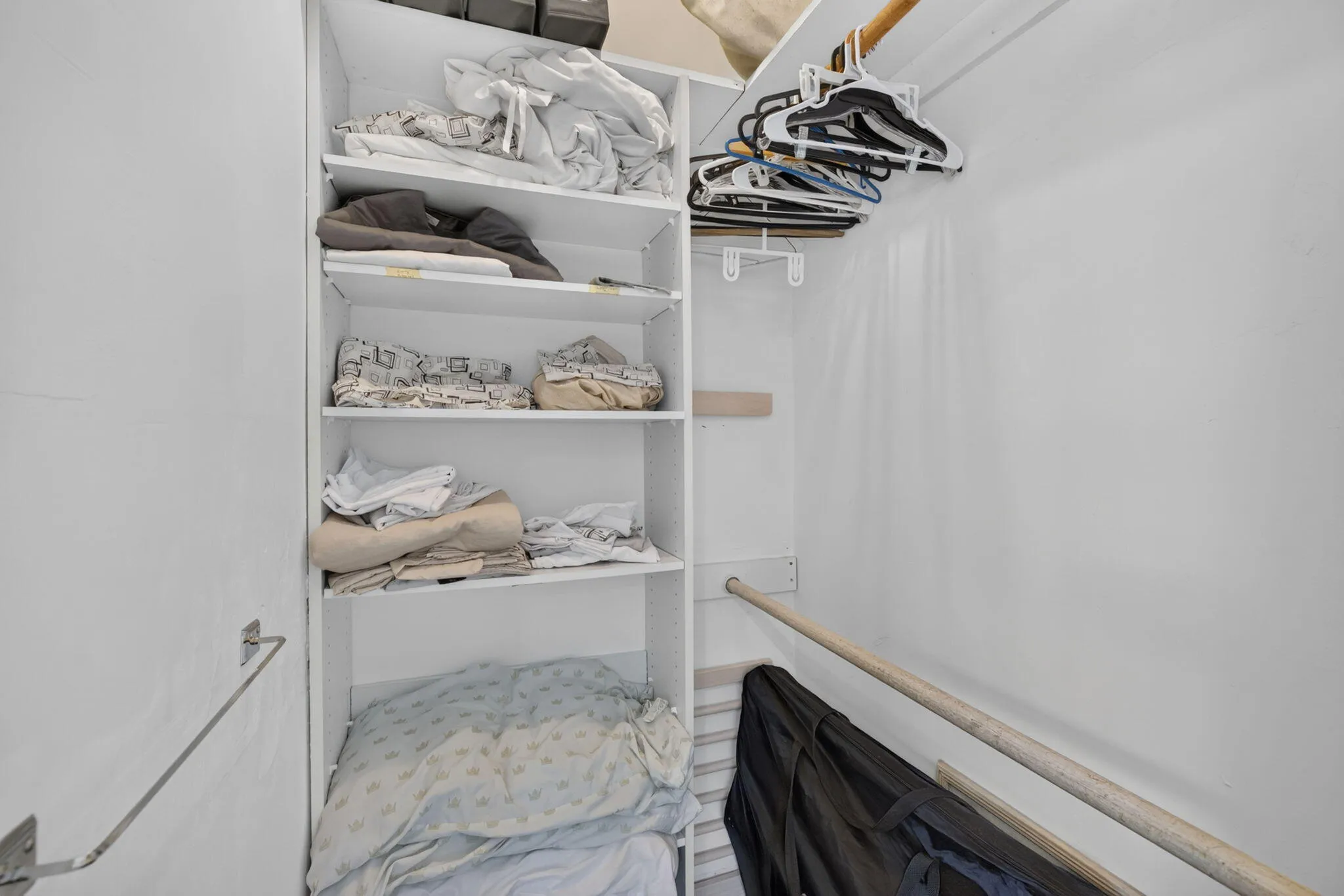 Walk-In Closet with Built-In Shelving and Full Hanging Storage