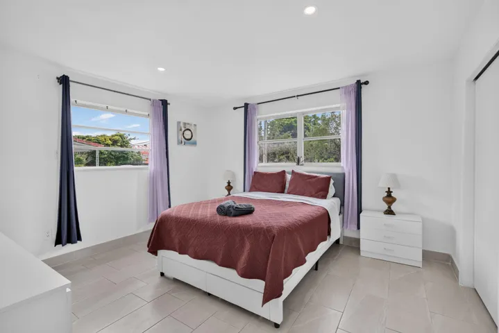 Bright Third Bedroom — Dual Windows and Built-In Dresser Storage