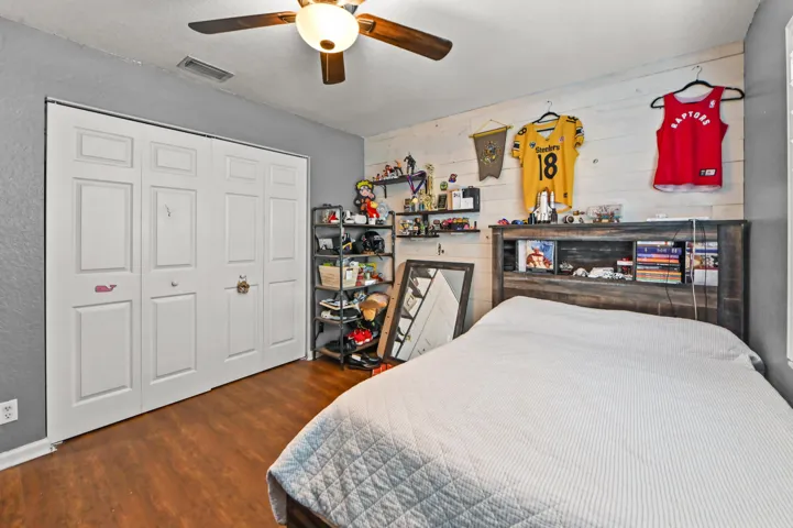 Wood-finish flooring with bi-fold closet doors