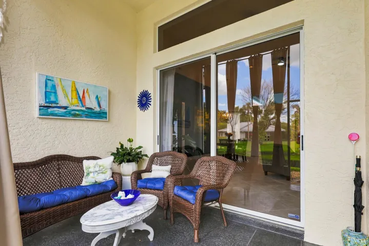 screen enclosed patio off living room at back of home