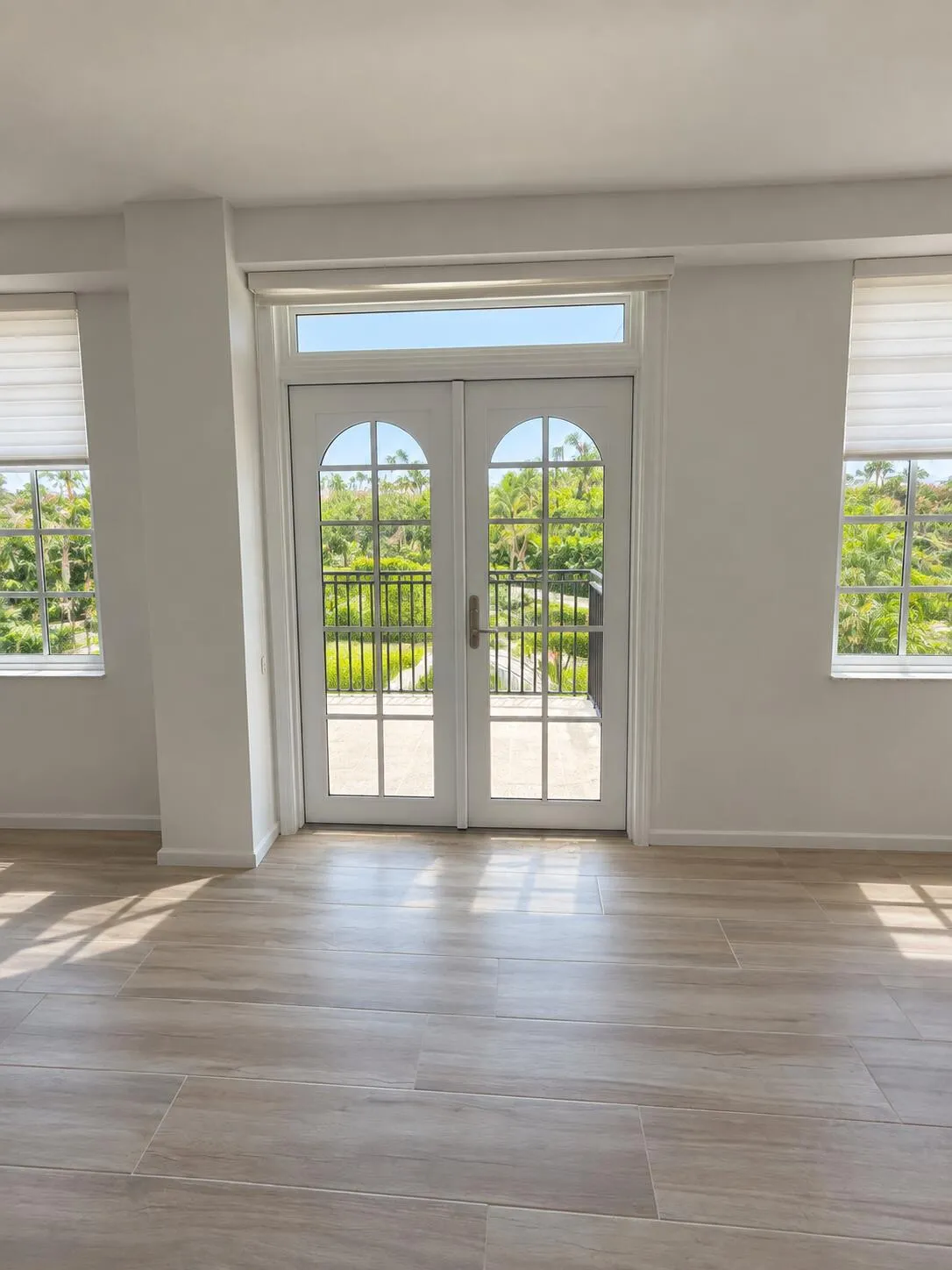 Light wood-finish tile flooring throughout the space