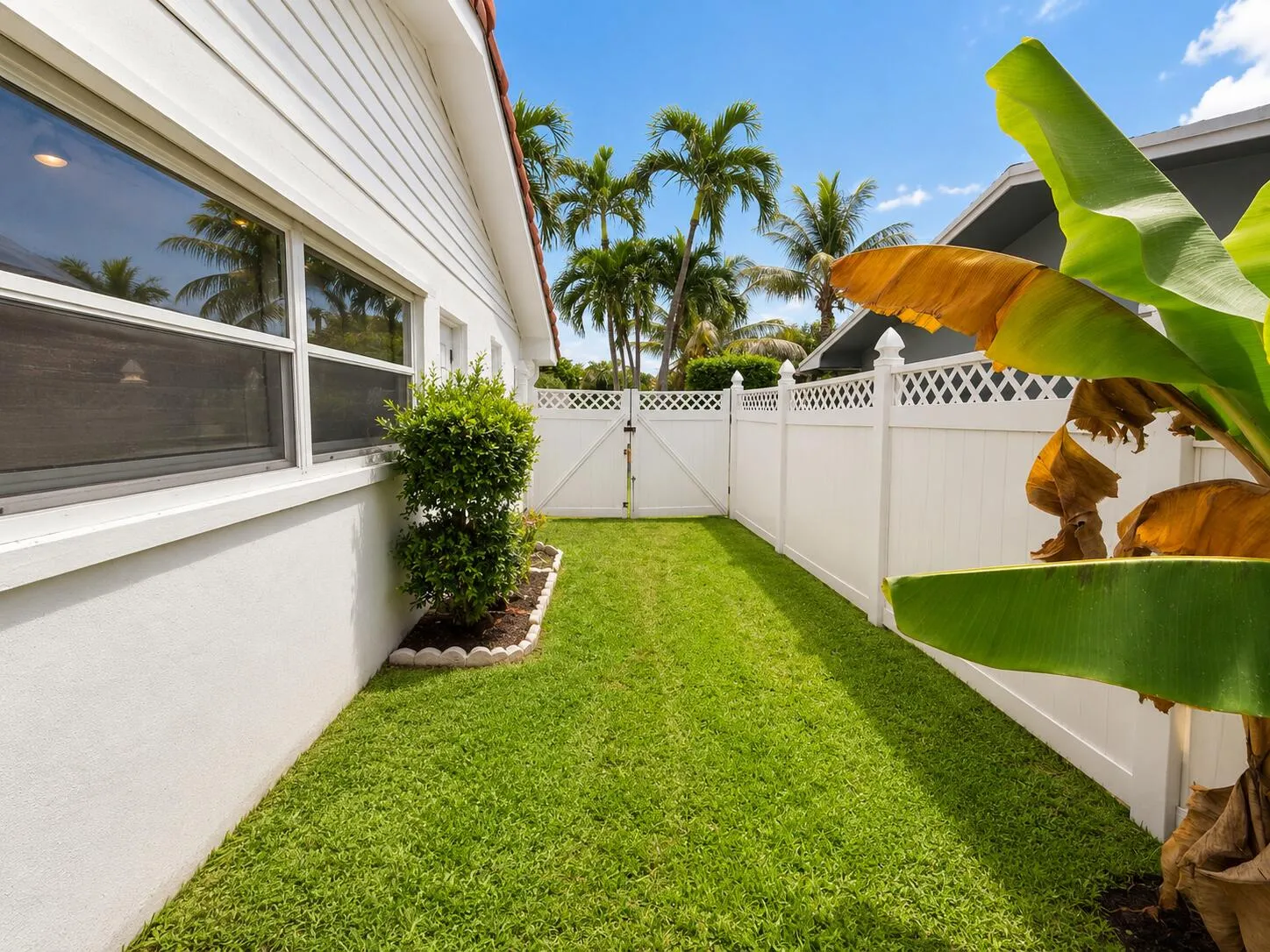 White horizontal siding and stucco exterior