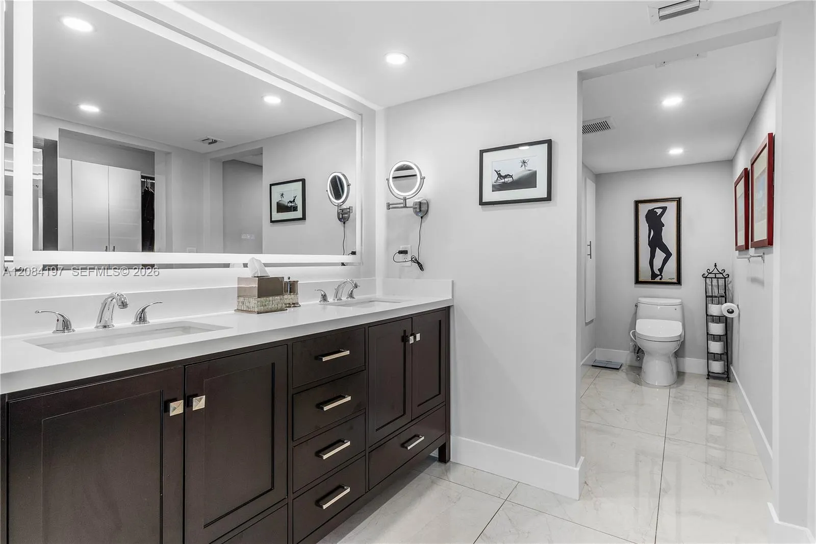 Completely renovated Primary Bathroom with Linen Close, Double Sinks, Designer Mirrors