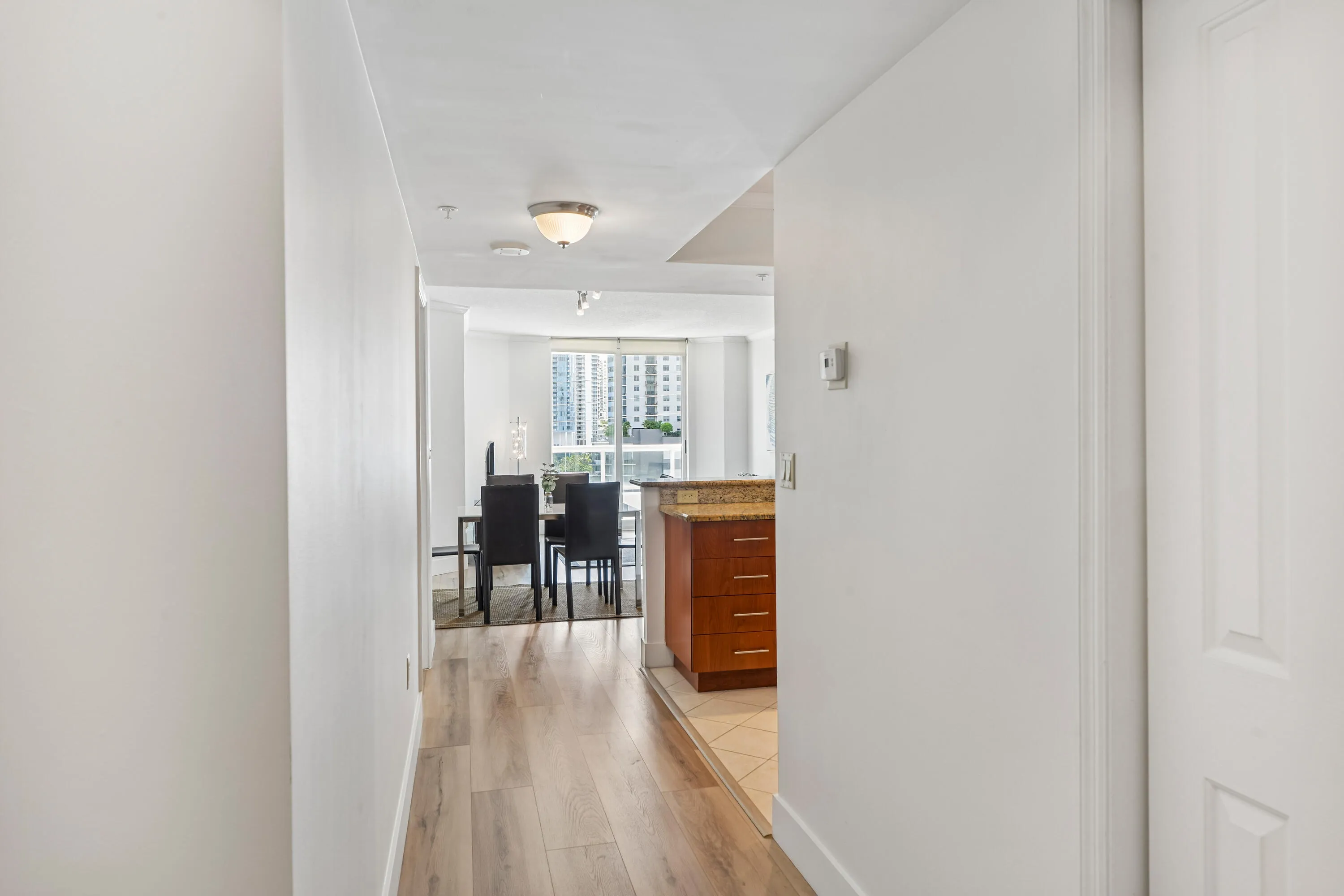 Large foyer entrance with laundry room to the left and large closet to the right.