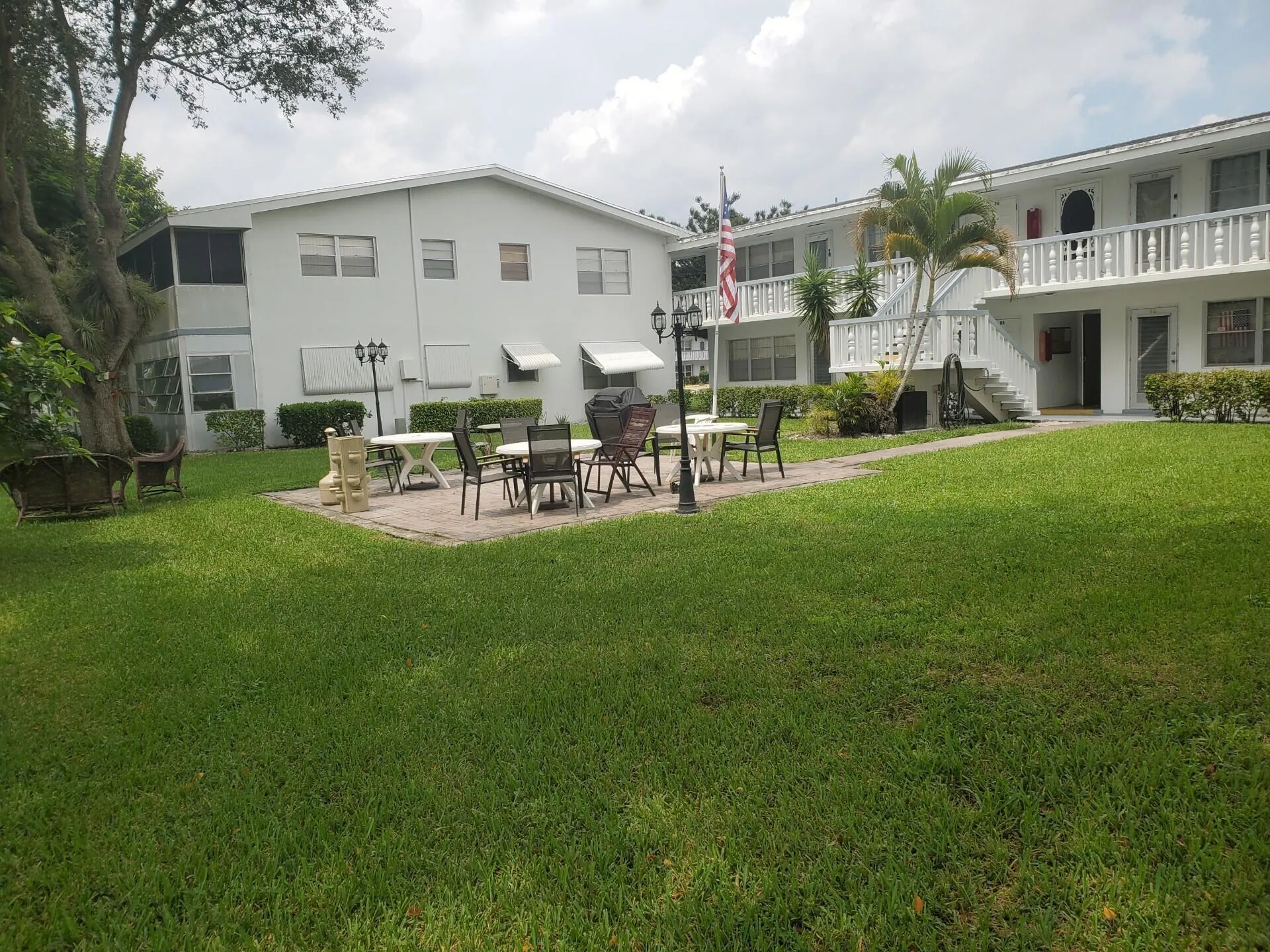 Resident only Patio w expansive green lawn, paver patio, mature trees