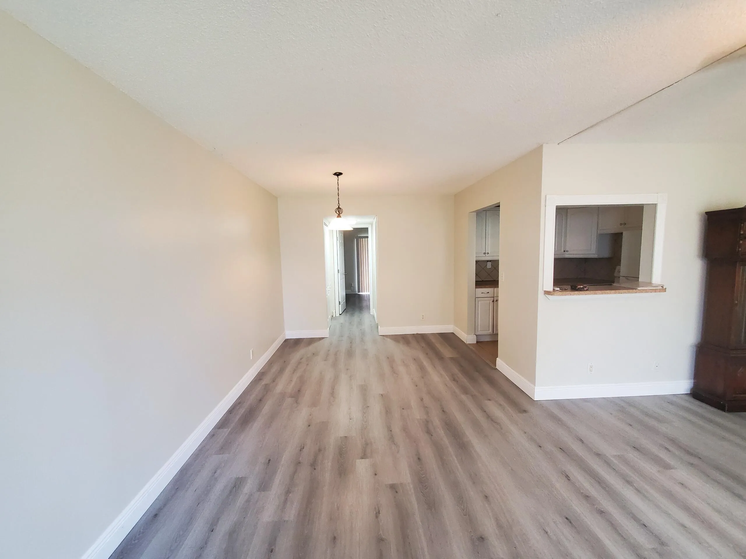 Wood-finish laminate flooring throughout. Ample Dining Area off Livingroom