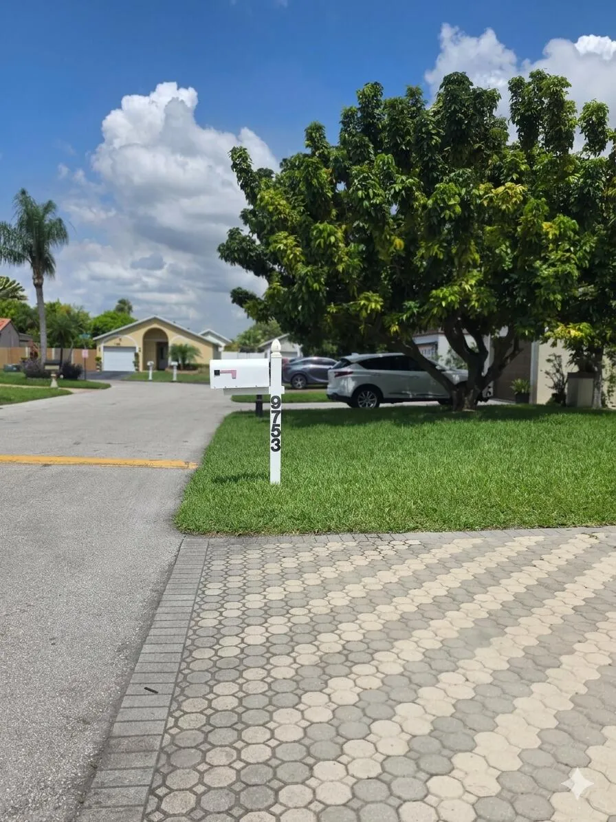 Expansive paved driveway and walkway with geometric pattern