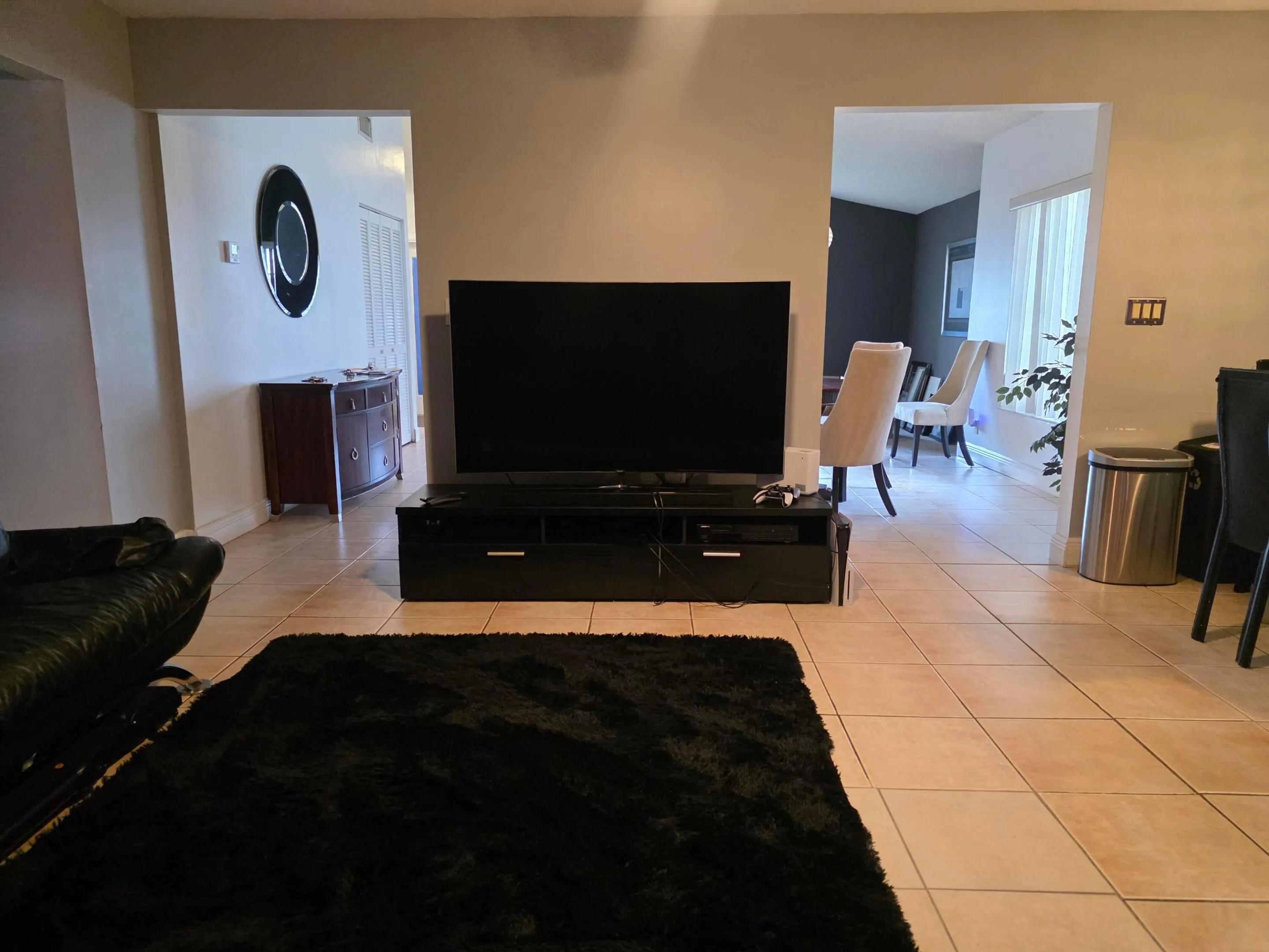 Tile flooring throughout. Family room adjacent to kitchen.