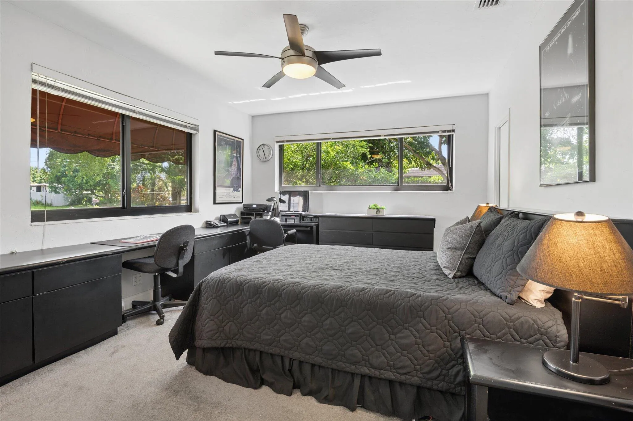 Original, primary, ensuite 15' x 12' bedroom with impact glass windows. Walk-in closet.
