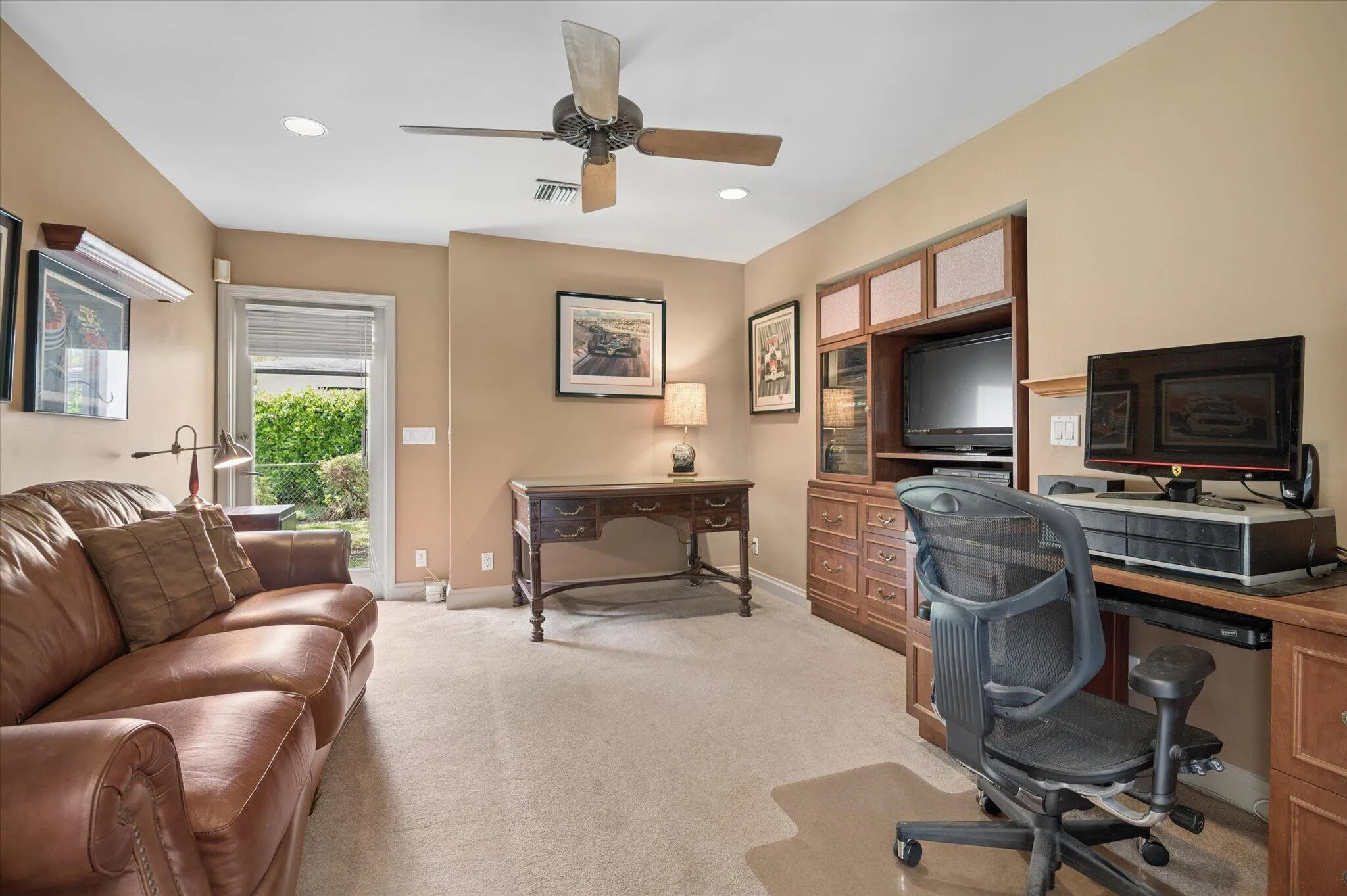 Fourth bedroom in 1991 addition. Exterior door makes this a good office for a home business. Remove the built-in cabinetry to restore the closet.