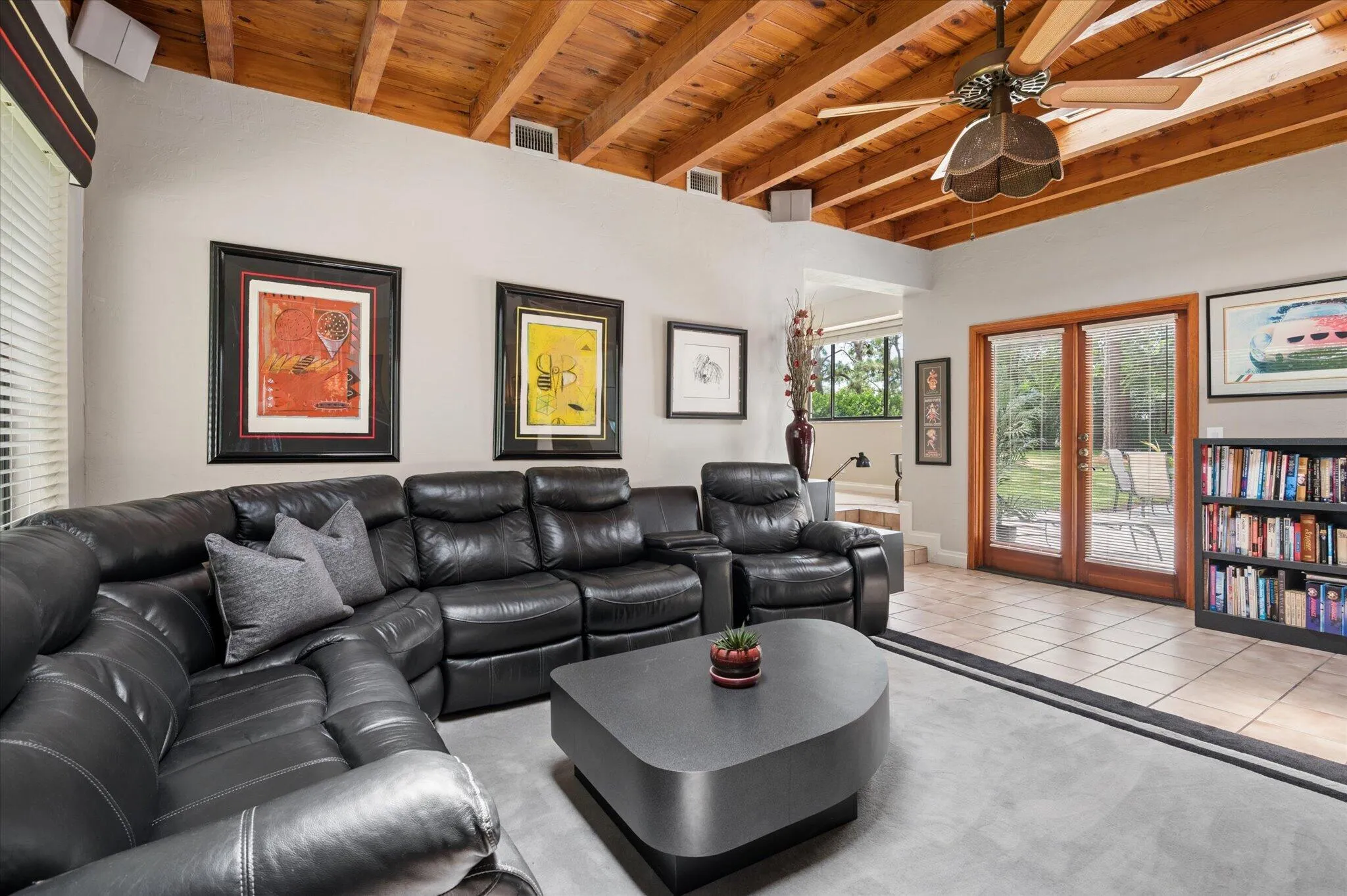 Family room with hurricane-rated skylight. French doors to patio and backyard. French doors have flood gates to prevent flooding should there be a 100-year flood.