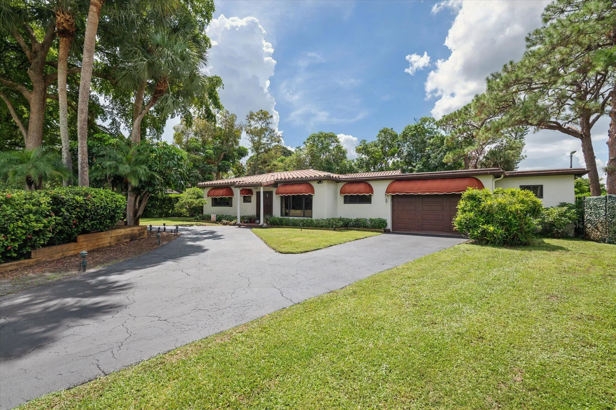 Front exterior with large, circular driveway