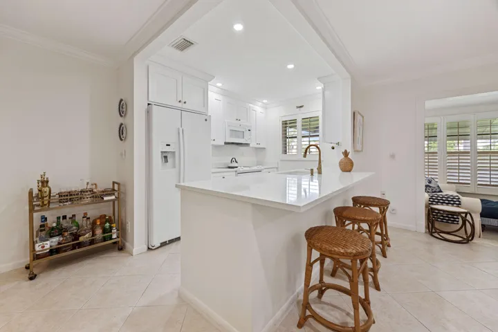 Open concept, quartz countertops, shaker style cabinetry