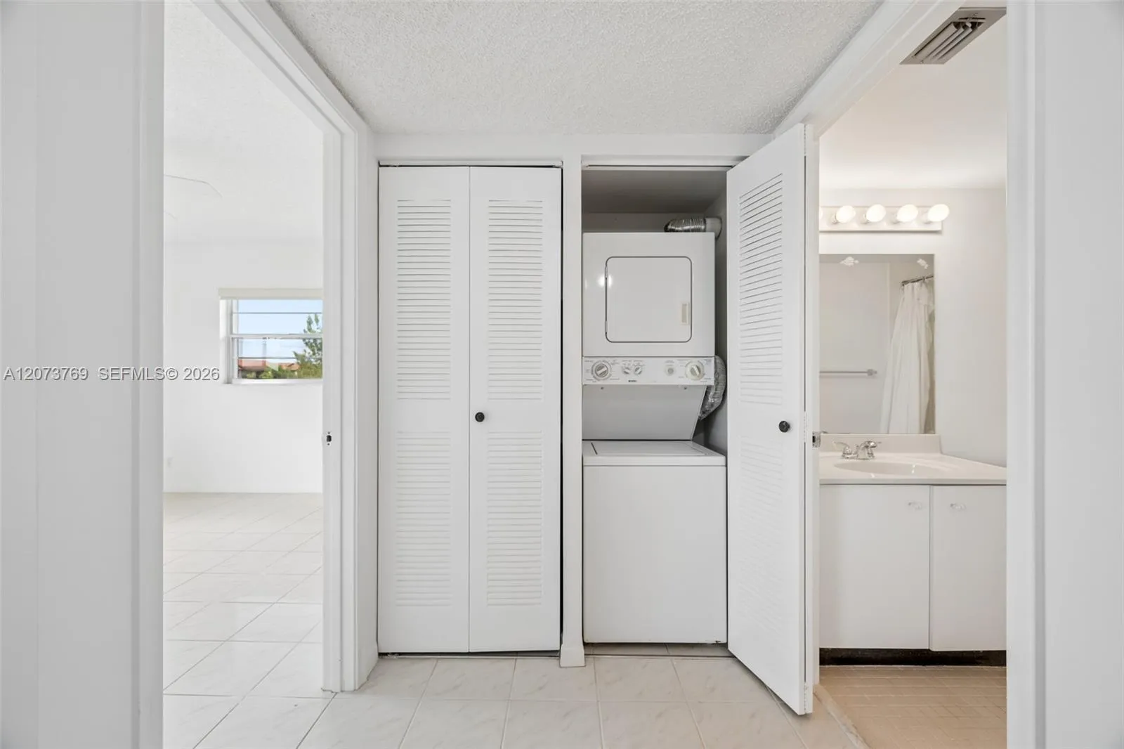 Entry and Guest Bedroom, Laundry Closet, and Guest Bedroom View